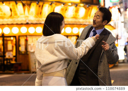 A drunk man in a downtown area at night A drunk man in a downtown area at night 110074889