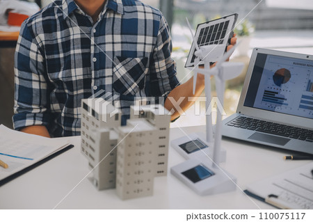 Electrical engineer with businessman discussing new project installation solar cell panel on the roof of building. Alternative energy concept. Electrical engineer with businessman discussing new project installation solar cell panel on the roof of building. Alternative energy concept. 110075117