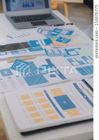 Close up ux developer and ui designer use augmented reality brainstorming about mobile app interface wireframe design on desk at modern office.Creative digital development agency Close up ux developer and ui designer use augmented reality brainstorming about mobile app interface wireframe design on desk at modern office.Creative digital development agency 110076775