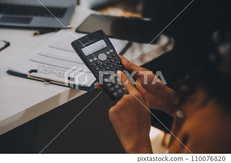 Electrical engineer with businessman discussing new project installation solar cell panel on the roof of building. Alternative energy concept. 110076820