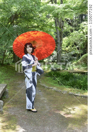 Portrait of a young woman wearing a yukata Portrait of a young woman wearing a yukata 110077192