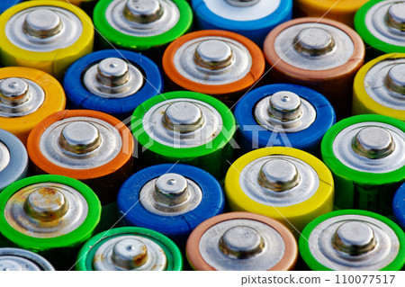 Old used batteries. Batteries background Old used batteries. Batteries background 110077517