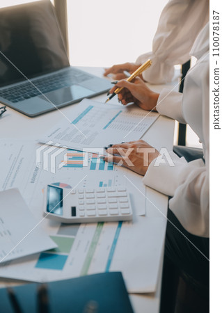 Business team collaboration discussing working analyzing with financial data and marketing growth report graph in team, presentation and brainstorming to strategy planning making profit of company. 110078187