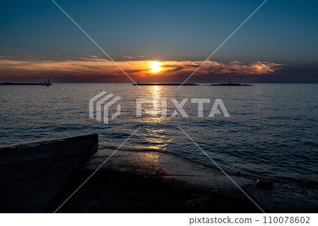 Sunset Over The Mediterranean Sea At The Beach Of The City Porec In Croatia 110078602