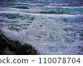 rocky seashore, surf and waves are broken by splashes and foam 110078704