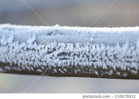 Frozen wooden fence, hoarfrost Frozen wooden fence, hoarfrost 110078932