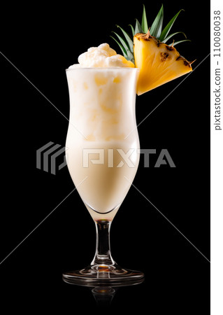 The classic Pina Colada with pineapple, coconut and creamy white top presented in a chilled glass with straw The classic Pina Colada with pineapple, coconut and creamy white top presented in a chilled glass with straw 110080038