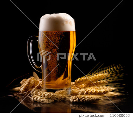 Beer in mug with wheat ears spikelets on black background. Mugs with drink like Ipa, Pale Ale, Pilsner, Porter or Stout Beer in mug with wheat ears spikelets on black background. Mugs with drink like Ipa, Pale Ale, Pilsner, Porter or Stout 110080093