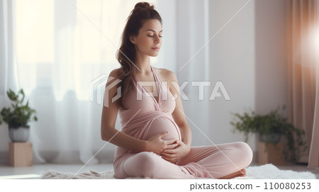 AI-generated content. A calm pregnant woman is meditating while sitting in the lotus position at home 110080253