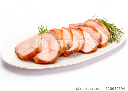 A closeup of sliced homemade cooked pork tenderloin on white background A closeup of sliced homemade cooked pork tenderloin on white background 110080394