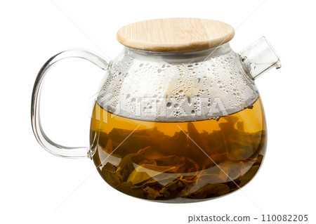 Hot green tea. Teapot with tea isolated on a white background. Hot green tea. Teapot with tea isolated on a white background. 110082205