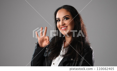 Young woman does an okay pose 110082405