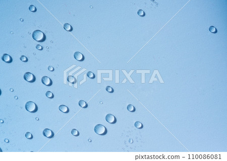 Blue transparent water drops, cosmetic texture. Moisturising cosmetics concept, spa texture. Skincare spray Blue transparent water drops, cosmetic texture. Moisturising cosmetics concept, spa texture. Skincare spray 110086081