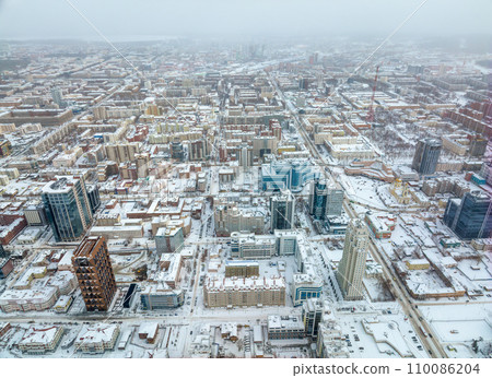 Yekaterinburg aerial panoramic view at Winter in cloudy day. Ekaterinburg is the fourth largest city in Russia located in the Eurasian continent on the border of Europe and Asia. 110086204