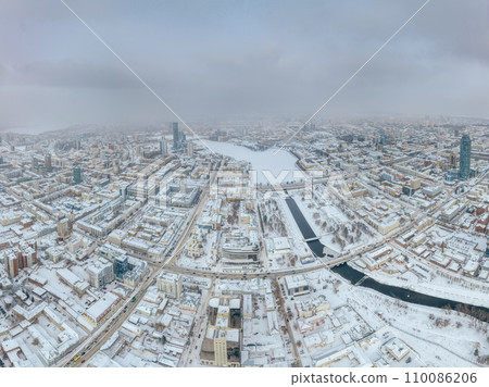 Yekaterinburg aerial panoramic view at Winter in cloudy day. Ekaterinburg is the fourth largest city in Russia located in the Eurasian continent on the border of Europe and Asia. 110086206