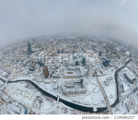 Yekaterinburg aerial panoramic view at Winter in cloudy day. Ekaterinburg is the fourth largest city in Russia located in the Eurasian continent on the border of Europe and Asia. Yekaterinburg aerial panoramic view at Winter in cloudy day. Ekaterinburg is the fourth largest city in Russia located in the Eurasian continent on the border of Europe and Asia. 110086207