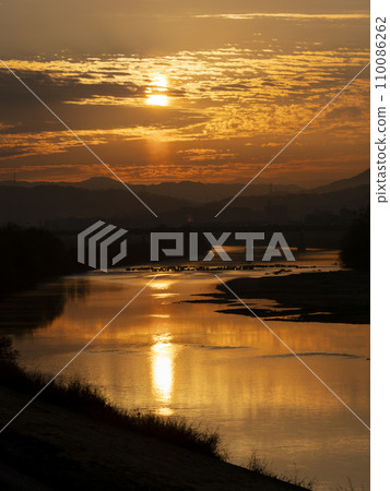 Landscape of the glowing orange sunrise Landscape of the glowing orange sunrise 110086262