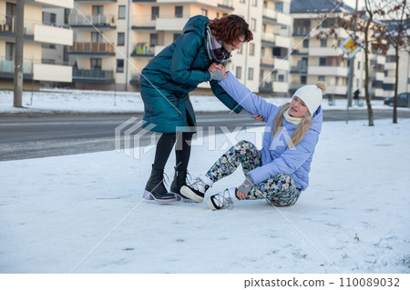 A random passerby picks up a strange woman from the sidewalk. A random passerby picks up a strange woman from the sidewalk. 110089032