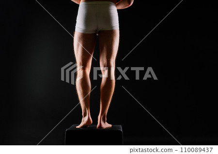 Panties on a sexual body. Guy or sexy macho with strong muscles, Athlete wearing white underwear. Panties on a sexual body. Guy or sexy macho with strong muscles, Athlete wearing white underwear. 110089437