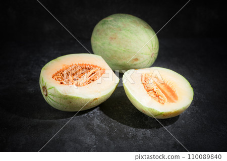 Fresh honeydew melon on dark background 110089840