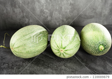 Fresh honeydew melon on dark background 110089879
