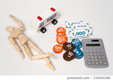 Image of medical expenses with fallen doll, money and calculator 110091086