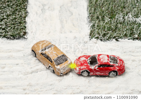 Image of a rear-end accident at an intersection on a snowy road 110091090
