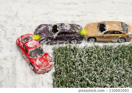 Image of a rear-end accident at an intersection on a snowy road 110091093