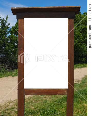 Blank white vertical rectangular pylon stand on forest dirt road mock up. Empty panel for advertisement, promotion mockup. Clear canvas frame banner for company advert template. Fruska Gora Serbia 110091584