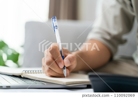 Man is calculating annual tax with calculator and filling form of Individual Income Tax Return. Season to pay Tax and Budget planning concept. Man is calculating annual tax with calculator and filling form of Individual Income Tax Return. Season to pay Tax and Budget planning concept. 110092069