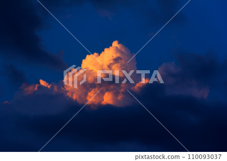 natural background of sky with clouds illuminated by the last sun rays at sunset natural background of sky with clouds illuminated by the last sun rays at sunset 110093037