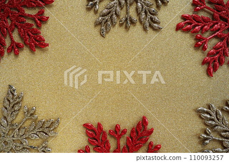 Six large silver and red flat ornate snowflakes are laid out on velvety gold paper. Free space for text. New Year or Christmas background for advertising. Festive winter flatlay. Yellow red gray color Six large silver and red flat ornate snowflakes are laid out on velvety gold paper. Free space for text. New Year or Christmas background for advertising. Festive winter flatlay. Yellow red gray color 110093257