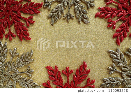 Six large silver and red flat ornate snowflakes are laid out on velvety gold paper. Free space for text. New Year or Christmas background for advertising. Festive winter flatlay. Yellow red gray color Six large silver and red flat ornate snowflakes are laid out on velvety gold paper. Free space for text. New Year or Christmas background for advertising. Festive winter flatlay. Yellow red gray color 110093258