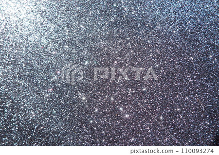 Oblique rays of light on a black surface. Bokeh, dust particles, reflection and magical glow. Festive shining background. New Year, Christmas, birthday. Plastic card design. Cosmic photons from space 110093274