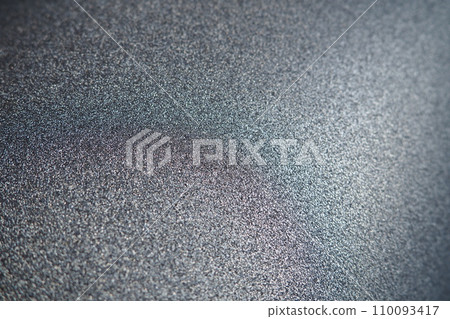 Black or dark gray background with shine. Texture of rough paper or cardboard. Defocused bokeh sparkles and shining from above. Festive black background with illuminated gradient Black or dark gray background with shine. Texture of rough paper or cardboard. Defocused bokeh sparkles and shining from above. Festive black background with illuminated gradient 110093417