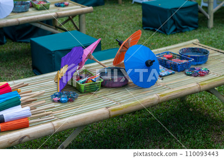 painting on Handmade umbrella of the village Bo Sang, Chiang mai, Thailand. 110093443