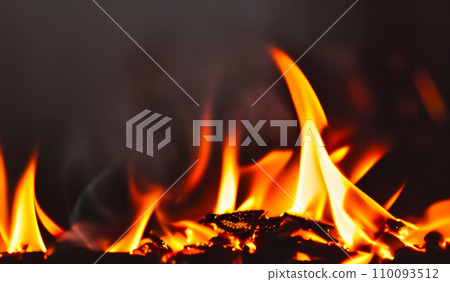 Fire lights on a black background. Fireballs in the night. A burning fire or fire. Danger from fire. The work of a fakir. Fire lights on a black background. Fireballs in the night. A burning fire or fire. Danger from fire. The work of a fakir. 110093512