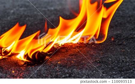 Fire lights on a black background. Fireballs in the night. A burning fire or fire. Danger from fire. The work of a fakir. Fire lights on a black background. Fireballs in the night. A burning fire or fire. Danger from fire. The work of a fakir. 110093513
