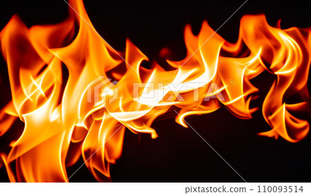 Fire lights on a black background. Fireballs in the night. A burning fire or fire. Danger from fire. The work of a fakir. Fire lights on a black background. Fireballs in the night. A burning fire or fire. Danger from fire. The work of a fakir. 110093514