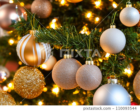Beautiful red, gold, silver, yellow, beige shiny and matte Christmas balls shine on a spruce branch. Happy New Year. Merry Christmas. Christmas background - baubles and branch of spruce tree. Beautiful red, gold, silver, yellow, beige shiny and matte Christmas balls shine on a spruce branch. Happy New Year. Merry Christmas. Christmas background - baubles and branch of spruce tree. 110093544