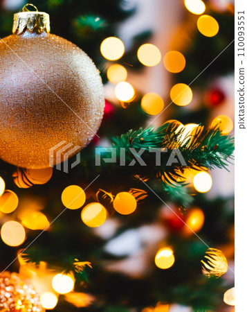 Beautiful red, gold, silver, yellow, beige shiny and matte Christmas balls shine on a spruce branch. Happy New Year. Merry Christmas. Christmas background - baubles and branch of spruce tree. Beautiful red, gold, silver, yellow, beige shiny and matte Christmas balls shine on a spruce branch. Happy New Year. Merry Christmas. Christmas background - baubles and branch of spruce tree. 110093551