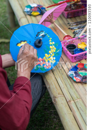 painting on Handmade umbrella of the village Bo Sang, Chiang mai, Thailand. painting on Handmade umbrella of the village Bo Sang, Chiang mai, Thailand. 110093593