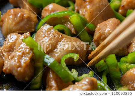 Stir-fried chicken and peppers, close-up of the cooking scene. 110093830