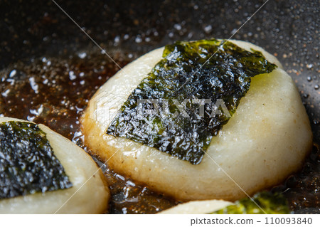 Isobeyaki cooking scene of mochi (round mochi). Leftover mochi remake image. Isobeyaki cooking scene of mochi (round mochi). Leftover mochi remake image. 110093840