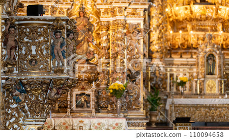 Intricate Gold Leaf Decorations on Baroque Church Altar 110094658