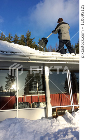 Snow cleaning from veranda, north of Sweden Snow cleaning from veranda, north of Sweden 110095125