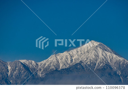 Shinshu winter scenery: clear blue sky and snow-covered Mt. Jonen Shinshu winter scenery: clear blue sky and snow-covered Mt. Jonen 110096378
