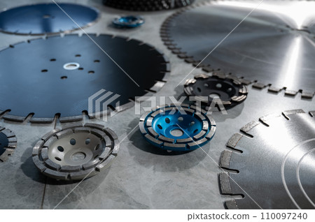 Diamond disks and bowls of different sizes and shapes lie on the table. Diamond disks and bowls of different sizes and shapes lie on the table. 110097240