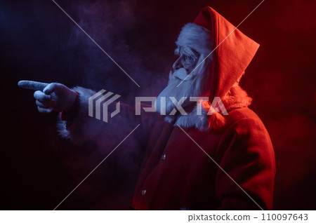 Santa Claus portrait in blue red neon light and smoke.  110097643
