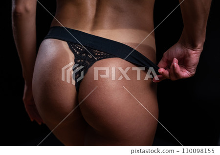 A faceless woman in black panties shows off the result of an instant tan A faceless woman in black panties shows off the result of an instant tan 110098155